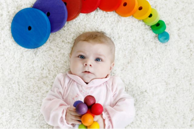 4-month-old baby with toys